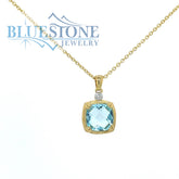 14 Karat Yellow Gold Pendant with a Blue Topaz and a 0.02 Carat Round